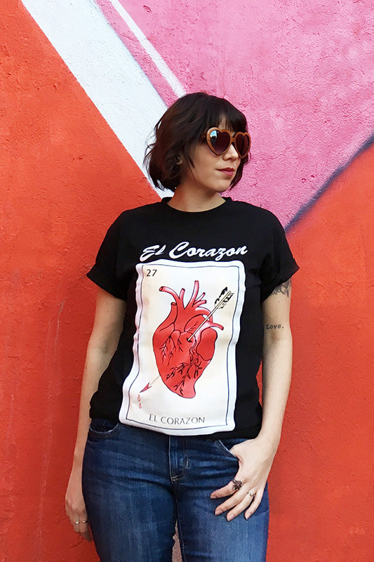 Modeling Mucho Merch-Suerte Loteria T-Shirt in El Corazon